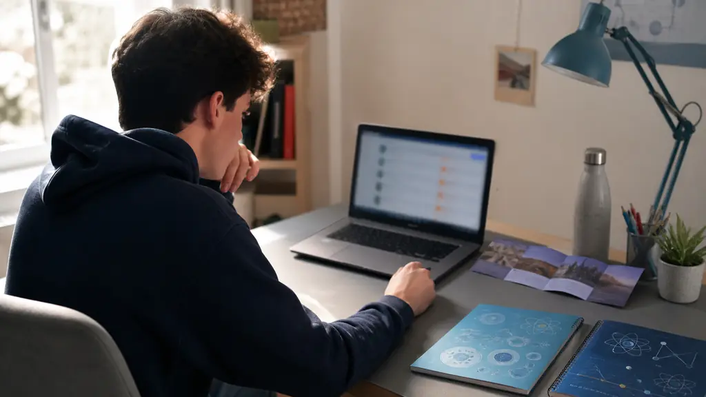 French student reviewing a Parcoursup application on a laptop, with SVT and physics-chemistry notebooks and an IFPP information leaflet on the desk, natural editorial photography, no visible text or logo